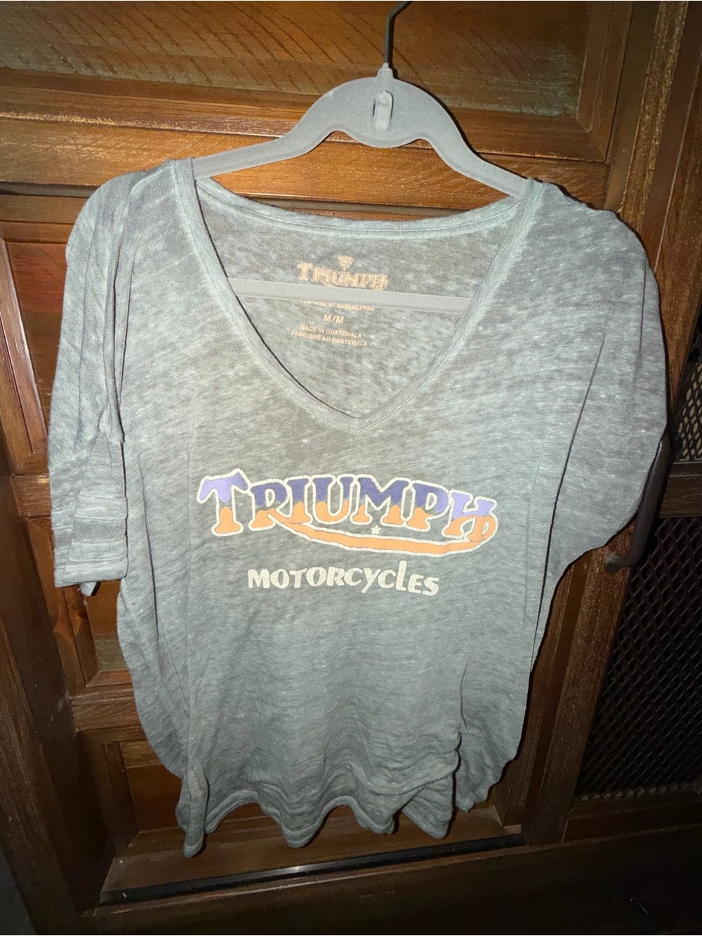 Triumph Gray V-Neck Graphic Tee with Orange and Purple Logo
